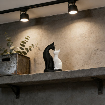 Black and white cat couple sculpture